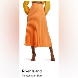 Orange pleated midi skirt